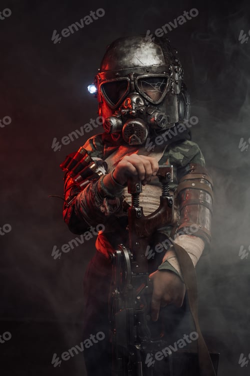 Preview: Young soldier in gas mask and armed with riffle in smoke