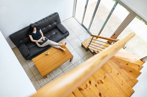 Preview: Woman Relaxing on Couch with Laptop Indoors