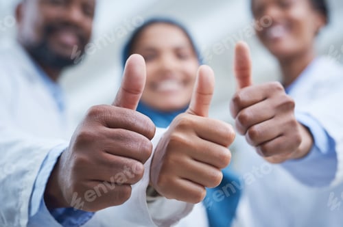 Preview: Shot of a group of scientists showing thumbs up while conducting research in a laboratory