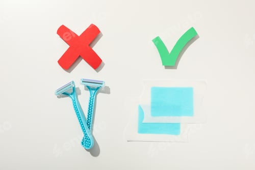Preview: Shaving razors with wax strips on a light background