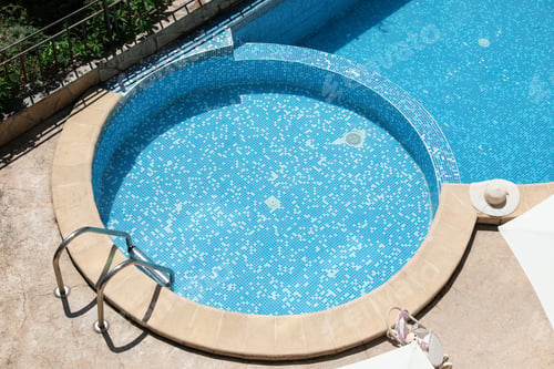 Preview: Outdoor swimming pool at luxury resort, above view