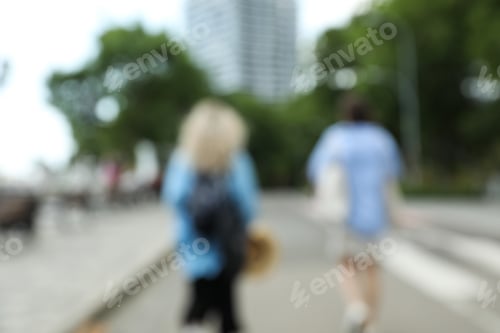 Preview: Blurred city photo with trees and people