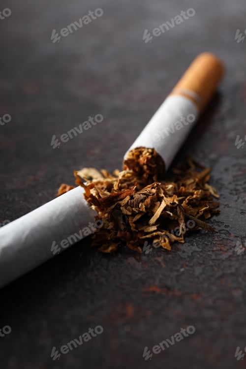 Preview: Concept of smoking addiction, broken cigarette, close-up.