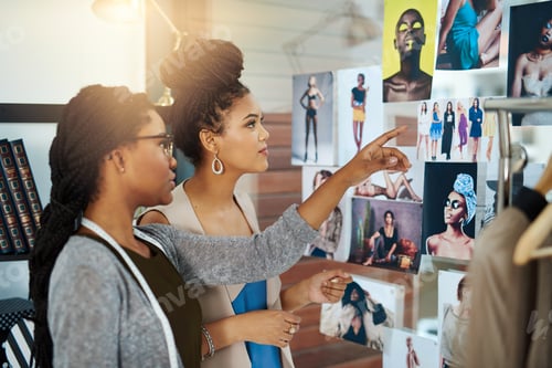 Preview: Shot of two young designers collaborating on a new design