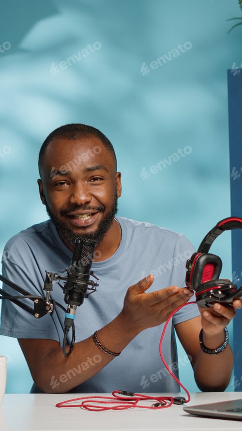 Preview: POV of influencer reviewing headphones on camera for vlog