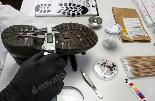 Preview: Police scientist investigates with a scale on a shoe sole tape tread