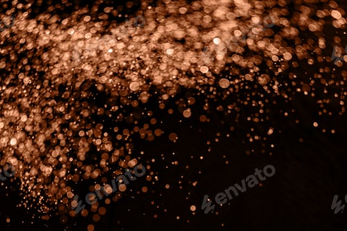 Preview: Blurry garland lights on a dark background. Image toned in color of the year 2024 - Peach Fuzz