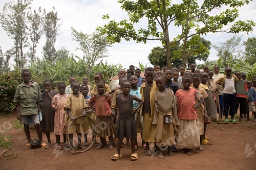 Preview: Group of children gathering with curiosity in a rural setting