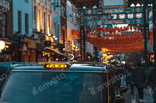 Preview: Illuminated taxi cab stands in london's chinatown during chinese new year festivities