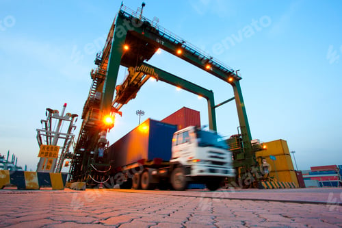 Preview: Blurred motion of truck with cargo containers and cranes in a shipping port