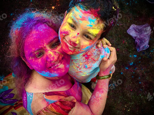 Preview: Happy Holi. Happy mom and son enjoying festival of colors
