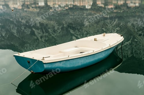Preview: Blue boat in Adriatic Sea gulf with mountains in Montenegro, Kotor