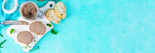 Preview: Sandwich with chicken liver pate on blue background. Top view