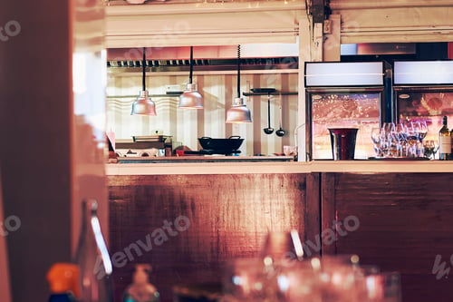 Preview: view of the modern restaurant kitchen bar from the diners' table