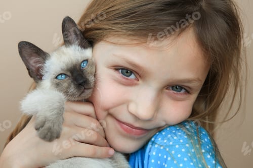Preview: Closeup of Young Girl with Siamese Kitten