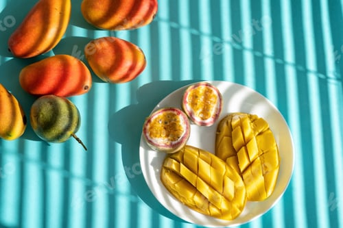 Preview: fruit slices on the plate: mango and passion fruit