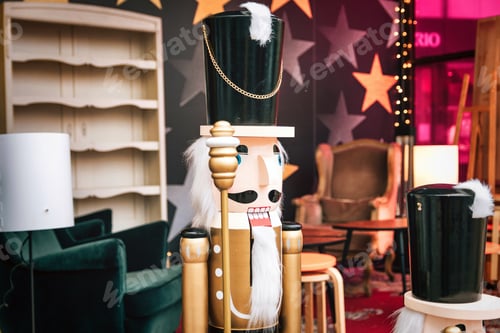 Preview: Wooden Nutcracker soldier statue as part of christmas decorations in city.