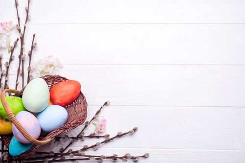 Preview: Colorful painted easter eggs in brown basket