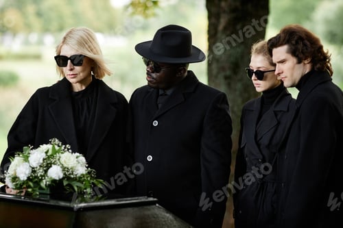 Preview: Back view of man wearing black at funeral ceremony