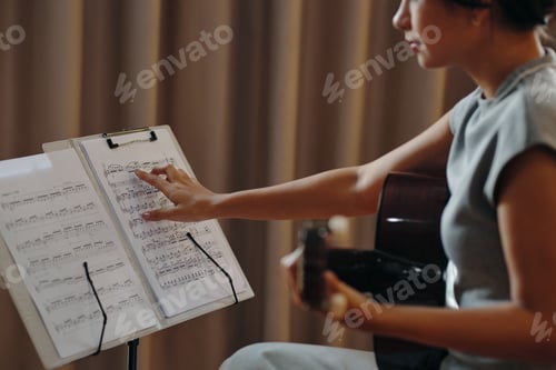 Preview: Playing Acoustic Guitar While Reading Music Notes
