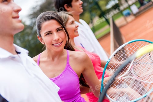 Preview: Female Tennis Player With A Group At The Court And Smiling
