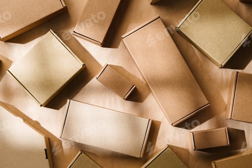 Preview: Multiple cardboard boxes arranged on a surface for packaging and shipping in a warehouse setting