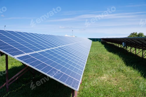 Preview: Solar batteries power station located in a field.