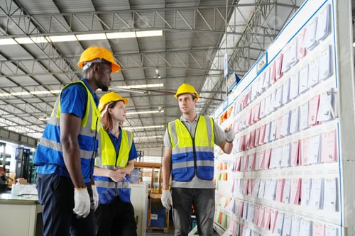 Preview: Three male and female warehouse workers are working in a warehouse