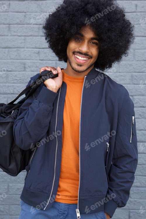 Preview: Smiling Young Man with Afro Holding Gym Bag