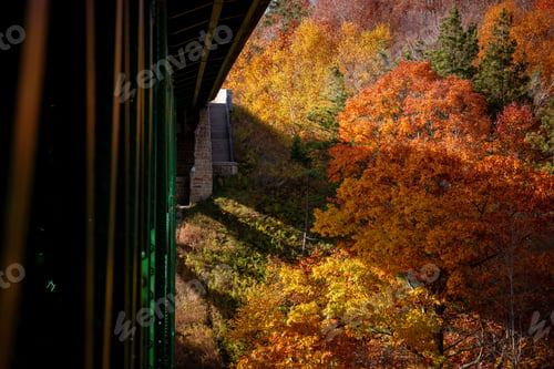 Preview: Cut River Bridge in Michigan, surrounded by vibrant fall colors of the forests