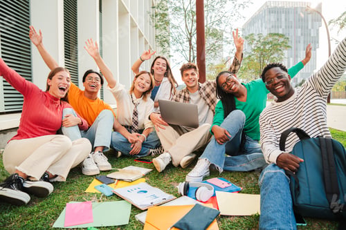 Preview: Portrait of a big group of happy teenage students sitting at university campus lawn, gesturing and