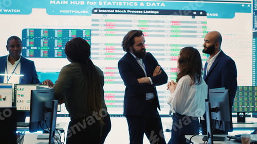 Preview: Staff members from a business enterprise discussing details and progress