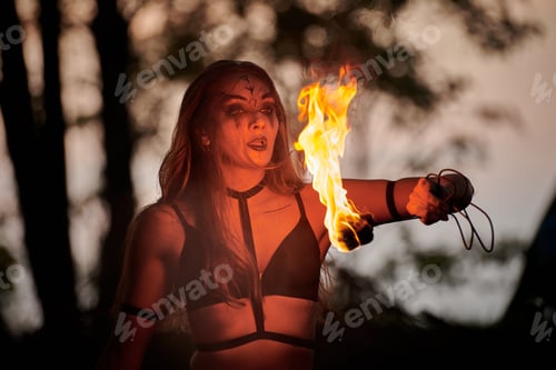 Preview: Girl fire dancing performance at outdoor art festival, smooth movements of female artist