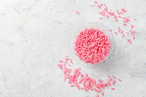 Preview: Pink strawberry chocolate drops and curls pile.