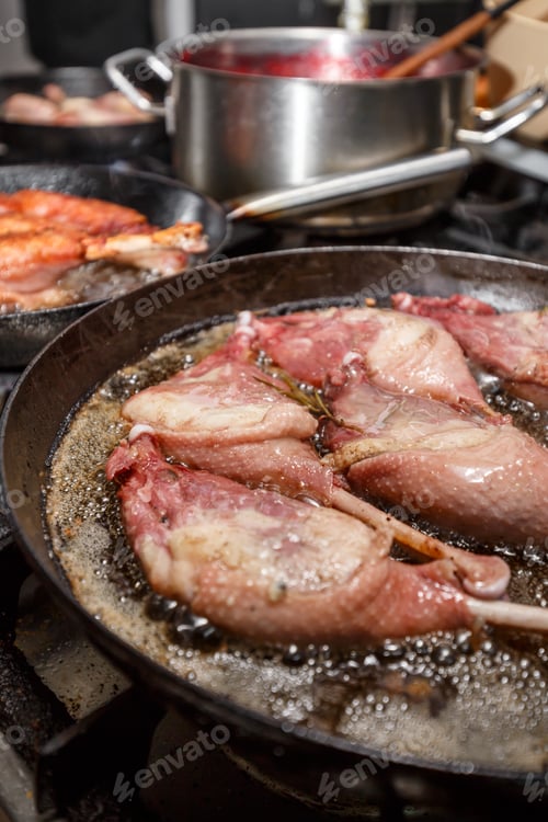 Preview: Goose drumstick frying in a pan
