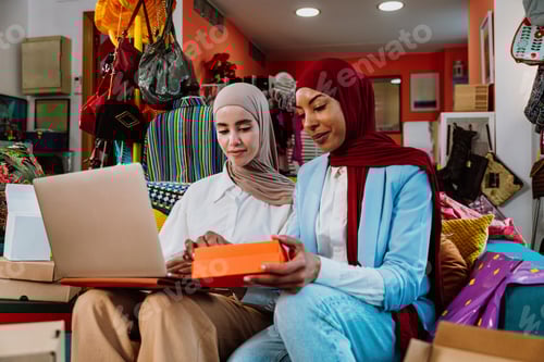 Preview: Muslim women entrepreneurs processing online orders in small business