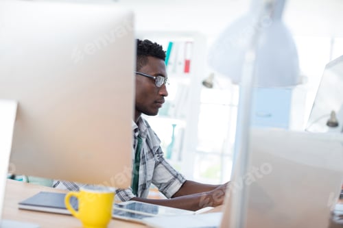 Preview: Executive working on computer in office
