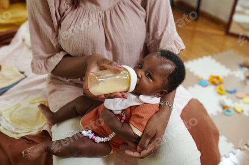 Preview: Mother Feeding Baby Girl