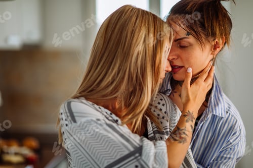 Preview: An affectionate couple sharing a kiss at home