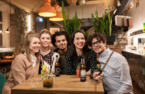 Preview: friends taking selfie by smartphone at bar or cafe