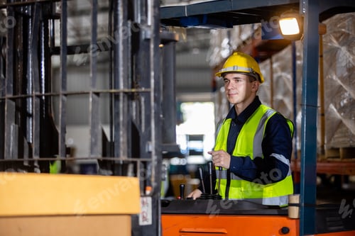 Preview: Man wear safety helmet driver forklift warehouse in factory. Male worker industrial operate.