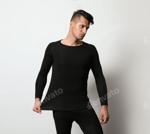 Preview: Man wearing thermal underwear on light grey background