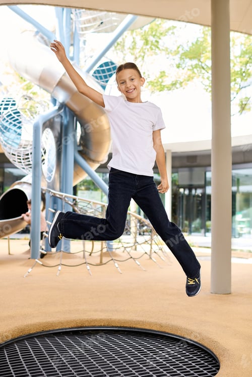 Preview: Joyful leap of a child in an autumn playground filled with adventure and happiness