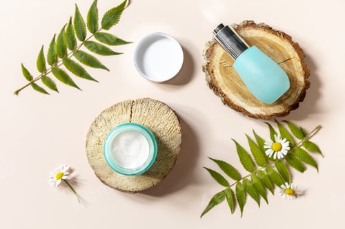 Preview: Cosmetic cream and face serum with cammomile flofers