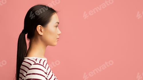 Preview: Woman Profile with Dark Hair on Pink Backdrop