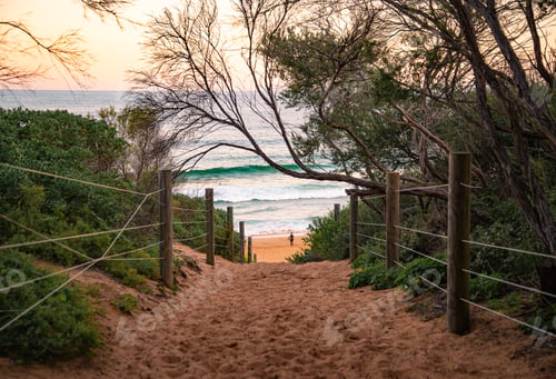 Preview: Path Through the Beach at the Sunset Time whit a Surfer Watching the Waves in Australia.