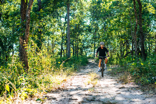 Preview: The man riding a bike in a mountain path
