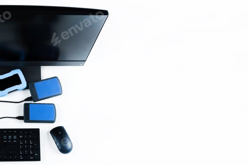 Preview: Multiple external hard drives connected to a monoblock on a white background.Computer with hard