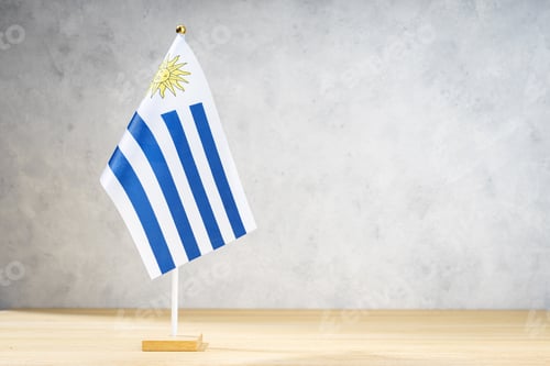 Preview: Uruguay table flag on white textured wall