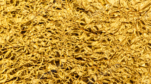 Preview: Bright yellow texture of crumpled and creased gold foil or leaf for background.